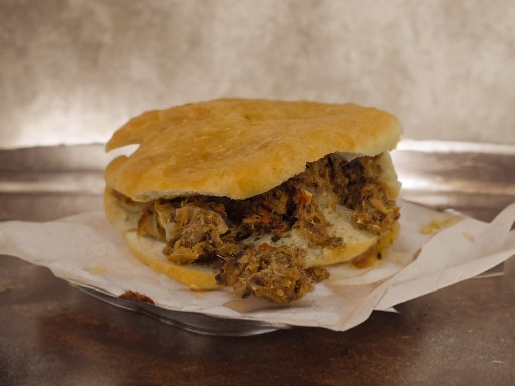 Bake filled with seasoned saltfish on Sarrah's cafe counter